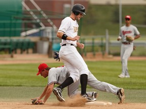 Edmonton's Cory Scammell (top) makes it on to second base past Medicine Hat's Nolan Rattai during a playoff game between the Edmonton Prospects and the Medicine Hat Mavericks at the former Telus Field in Edmonton on August 7, 2016.