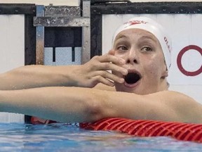 Canada's Penny Oleksiak reacts with surprise after winning the silver medal in the women's 100-metre butterfly final at the 2016 Summer Olympics in Rio de Janeiro on Sunday, August 7, 2016.