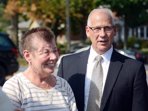 In this Sept. 3, 2015 file photo, Sharon and Randy Budd talk with friends and relatives outside the Union County Court House in Lewisburg, Pa., after three young men were sentenced to time behind bars for throwing a rock off a highway overpass in central Pennsylvania, causing severe brain trauma to Sharon, an Ohio teacher. Randy Budd, has died at age 55. Harry Campbell, chief investigator for the Stark County Coroner’s office, told The Associated Press on Sunday, Aug. 7, 2016, that Budd died of a self-inflicted gunshot wound and was pronounced dead at his Uniontown, Ohio, home late Saturday. (Amanda August/The Daily Item via AP, File)