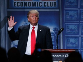 Republican presidential candidate Donald Trump waves after delivering an economic policy speech to the Detroit Economic Club, Monday, Aug. 8, 2016, in Detroit. (AP Photo/Evan Vucci)