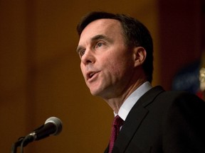 Finance Minister Bill Morneau speaks to the Economic Club of Canada about long-term growth for the middle class, in Toronto, on Thursday, June 23, 2016. The federal government has weighed the pros and cons of a financial deterrent aimed at shrinking bulging waistlines: a tax on soda pop. THE CANADIAN PRESS/Eduardo Lima