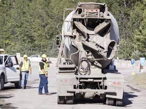 A concrete mixing truck enters Lafarge Canada at 1649 Bearbrook Rd where it's reported a man was killed after falling into a cement truck Monday, August 8, 2016. (Darren Brown/Postmedia)