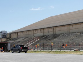 The Kingston Memorial Centre grandstand is fenced off while a crew from Doornekamp Construction make repairs to the outside seating area. (Julia McKay/The Whig-Standard)