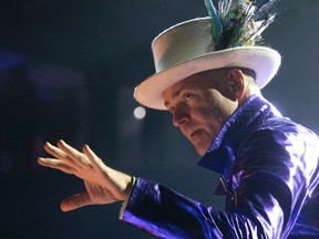 The Tragically Hip frontman Gord Downie brought his trademark wild energy to Budweiser Gardens Monday night ? striking poses, making beautiful and puzzling faces and singing to more than 9,900 fans. (CRAIG GLOVER, The London Free Press)