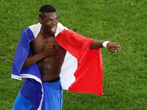 France’s Paul Pogba celebrates after beating Germany in the Euro 2016 semifinal at the Velodrome stadium in Marseille, France, Thursday, July 7, 2016. (AP Photo/Michael Sohn)