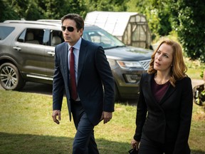 David Duchovny, left, and Gillian Anderson in the "Founder's Mutation" season premiere, part two, episode of "The X-Files." (Ed Araquel/FOX via AP)