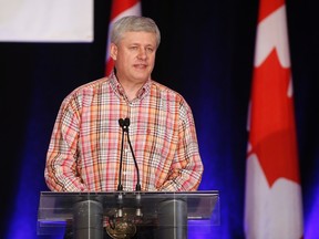 Former prime minister Stephen Harper speaks to attendees at the annual Calgary Conservative barbecue in Calgary, on Saturday, July 9, 2016. (THE CANADIAN PRESS/Jeff McIntosh)