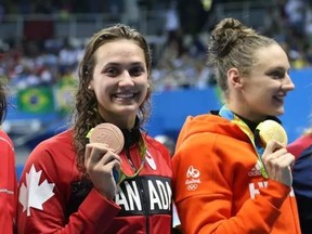 Bronze medalist Kylie Masse of Canada and gold medalist Katinka Hosszu of Hungary. (Jean Levac / Postmedia)
