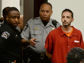 Chad Cameron Copley, 39, is led into a courtroom at the Wake County Judicial Center in Raleigh, N.C. Monday, Aug. 8, 2016. Copley, who apparently called police to complain about "hoodlums" near his house, was charged with murder after he shot and killed a black man outside, authorities said. (Chuck Liddy/The News & Observer via AP)