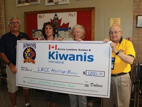 Golden K Kiwanis members presented a cheque worth $1,200 to the Lochiel Kiwanis Community Centre in order help fund the centre's Centennial Heritage Picnic on Thursday, Sept. 1. From left to right: Golden K Kiwanis president Bob Lutz, the LKCC's Carla Harwood and Debbie Martin and Sarnia Kiwanis Foundation president Terry North. 
CARL HNATYSHYN/SARNIA THIS WEEK