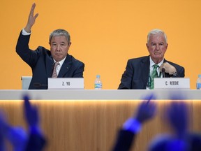 International Olympic Committee (IOC) executive member and current president of the World Anti-Doping Agency Britain's Sir Craig Reedie (R) watches the attendees as IOC executive member China's Yu Zaiqing raises his hand during a confidence vote during the 129th International Olympic Committee session, in Rio de Janeiro on August 2, 2016, ahead of the Rio 2016 Olympic Games.International Olympic Committee chief Thomas Bach on Tuesday demanded a sweeping overhaul of the World Anti-Doping Agency (WADA) on Tuesday as Russian appeals against bans mounted just three days from the opening of the Rio Games. / AFP PHOTO / FABRICE COFFRINIFABRICE COFFRINI/AFP/Getty Images