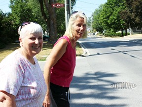 Intelligencer file photo
Ruth McCrory stands in front of Tina Devries as they try to cross at West Front St. in Stirling. Stirling-Rawdon council, earlier this week, reversed its decision to reduce the number of crossing guards in the municipality. Both McCrory and Devries were set to lose their jobs based on the initial decision.