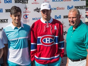 Montreal Canadiens head coach Michel Therrien (right) stands next to newly-acquired defenceman Shea Weber, centre, and captain Max Pacioretty at the Michel Therrien Golf Invitational Tuesday, August 9, 2016 in Terrebonne, Que. (THE CANADIAN PRESS/Paul Chiasson)