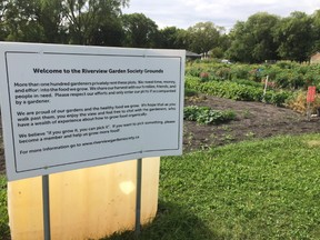 A sign outside garden plots in Winnipeg run by the Riverview Garden Society, shown on Tuesday, Aug.9, 2016, is aimed at deterring thieves. The society has noticed an increase in theft in recent years.