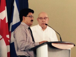 Sajid Mughal (left) president of iTaxiworkers Association and lawyer Peter Rosenthal.
(KEVIN CONNOR, Toronto Sun)