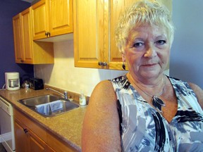 Jeri Pearce, Willowgrove United Church refugee sponsorship committee spokesperson, says members are working to familiarize the newly arrived Syrian family with household gadgets. JEFFREY OUGLER/SAULT STAR