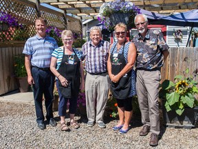 Town of Vermilion Manager Dion Pollard stands with Communities in Bloom Committee members Donna Moon and Janice Jones, and Judges Ted Zarudny and Larry Hall on Monday, July 25, 2016, in Vermilion, Alta. The group toured the town, which is one of six communities vying for a win from the Communities in Bloom National Finalists Competition. Taylor Hermiston/Vermilion Standard/Postmedia Network.