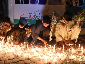 Pakistani youths place candles at the site during a vigil to pay tribute to victims a day after a suicide bombing at the Civil Hospital in Quetta on August 9, 2016.
Pakistan's lawyers boycotted courts and staged protests nationwide on August 9 after a horrific suicide bombing at a Quetta hospital which killed 72 people including many of their colleagues. / AFP PHOTO / BANARAS KHANBANARAS KHAN/AFP/Getty Images