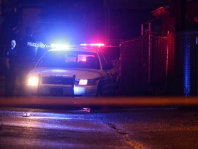 Police investigate the scene of a shooting near 85 Street 111 Avenue on Tuesday, August 9, 2016. DAVID BLOOM / Postmedia
