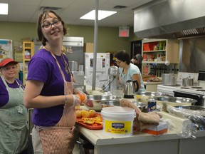 Lindsay Yeck, left, and Kelsy Bechard, centre, works in the kitchens at Parkfield Restaurant, a Community Living initiative preparing people with developmental disabilities for competitive employment. The staff gets valuable experience from their work at Parkfield -- and the food they make is excellent.