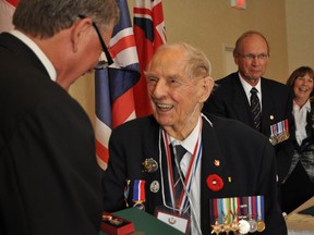 Intelligencer file photo
Phil Etter, who served with the Merchant Navy during the Second World War, wass awarded a Queen Elizabeth II Diamond Jubilee Award in September 2012. Mr. Etter died Aug. 6 at Belleville General Hospital.