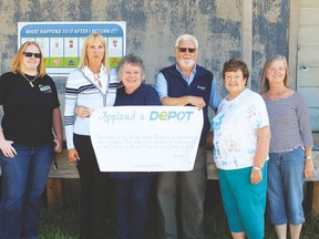 Pictured (L. to r.) Laura Nelson,Member Services Co-ordinator, Alberta Bottle Depot Association, customer Karen Rylance, Breton Bottle Depot owners Rosemary and Neil Durrant, Breton Village Councillor Janet Young and Brazeau County Councillor Maryann Thompson.