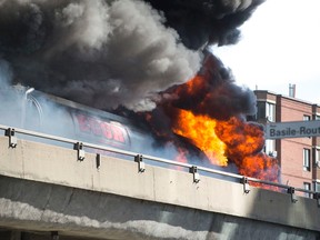 A tractor trailer carrying fuel burns on the elevated highway by Cremazie and Basile Routhier in Montreal, on Tuesday, August 9, 2016. (Peter McCabe/MONTREAL GAZETTE/Postmedia Network)