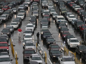 In this Dec. 3, 2014, file photo, cars wait to enter the United States from Tijuana, Mexico through the San Ysidro port of entry in San Diego. (AP Photo/Gregory Bull, File)