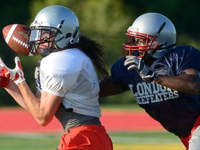 London Beefeaters defensive back Isaiah Nganga, right, tips the ball away from receiver Zach Pembry during a practice at City Wide Fields on Wednesday.  (MORRIS LAMONT, The London Free Press)