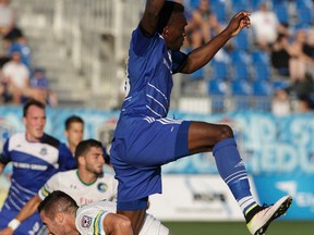 Edmonton's Tomi Ameobi (18) battles New York's Hunter Freeman (2) during NASL soccer play between FC Edmonton and the New York Cosmos at Clarke Stadium in Edmonton on July 27, 2016.