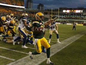 Edmonton's Kenzel Doe (86) runs the ball out of bounds during the second half of a CFL football game between the Edmonton Eskimos and the Winnipeg Blue Bombers at Commonwealth Stadium in Edmonton, on July 28, 2016.