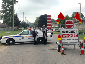 RCMP controlling the zone. No access after this point today. People living after the second check point haven't been allowed to go to their homes since last night. An officer said they think they will be allowed around noon. (Jonathan Juha, Postmedia Network)