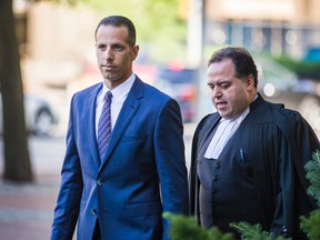 Alexander (Sandro) Lisi, joined by lawyer Domenic Basile, arrives at the courthouse at 361 University Ave. on Aug. 11, 2016. (Ernest Doroszuk/Toronto Sun)