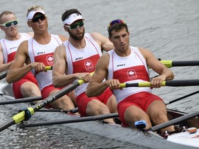 (From left) Canada's Will Crothers, Tim Schrijver, Conlin McCabe and Kai Langerfeld row during the Men's Four rowing competition at the Lagoa stadium during the Rio 2016 Olympic Games in Rio de Janeiro on August 8, 2016. (Damien MEYERDAMIEN MEYER/AFP/Getty Images)