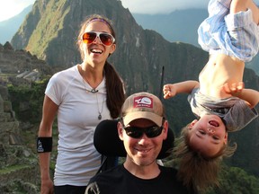 In this image released by Open Road Films, former New Orleans Saints safety Steve Gleason, left, appears with his son Rivers, right, and wife Michel in a scene from the documentary "Gleason." The film follows Gleason and his wife, Michel, into the maelstrom of ALS, or Lou Gehrig’s disease, as the couple adjusts to their fluctuating reality and makes way for their son, Rivers. (Open Road Films via AP)