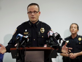 Punta Gorda, Fla., Police Chief Tom Lewis gestures as he speaks to the media at the Public Safety Complex Wednesday, Aug. 10, 2016, in Punta Gorda, Fla. Police say an officer accidentally shot a woman to death during a citizen's academy "shoot/don't shoot" exercise Tuesday evening. (AP Photo/Chris O'Meara)