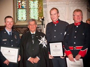 Andrew Vickers, second from right, poses for a photo in this 2012 handout photo. The son of Parliament Hill shooting hero Kevin Vickers is being commended for his part in saving a woman's life - again. (THE CANADIAN PRESS/HO - St. John Ambulance Saint-Jean - Harry Mullin)