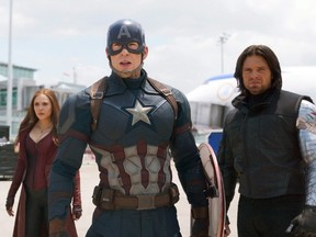 This image released by Disney shows Elizabeth Olsen, left, Chris Evans and Sebastian Stan in a scene from Marvel's "Captain America: Civil War." This summer's "Captain America: Civil War" delivered the biggest percentage of business for Cineplex in the second quarter but it fell short of Marvel's "The Avengers: Age of Ultron" ticket sales last year. (THE CANADIAN PRESS/ AP, Disney-Marvel)