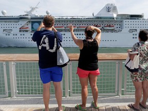 In this Monday, June 20, 2016, photo, the Royal Caribbean cruise ship Empress of the Seas heads out of PortMiami, in Miami Beach, Fla. Royal Caribbean reports financial results Tuesday, Aug. 2, 2016. (AP Photo/Lynne Sladky)