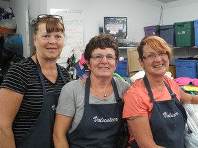 Elaine Gunderson (left), Val Scott and Rosemary Watson of the Friends of Whitecourt society work a shift together at the Repeat Boutique. The organization is celebrating its 50th anniversary and is calling volunteers from around the region to celebrate.