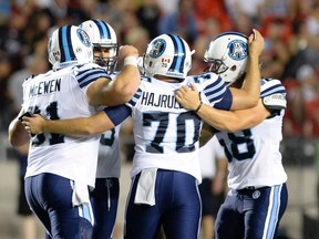 The Toronto Argonauts are in it together as they face a brutal stretch of games. (THE CANADIAN PRESS/Justin Tang)
