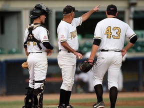 The Edmonton Prospects' Paul Richy (43) is pulled by head coach Ray Brown in the 6th inning against the Medicine Hat Mavericks during Game 4 of the WMBL playoff series at the former Telus Field, in Edmonton on Monday Aug. 8, 2016. Catcher Logan Wedgewood is pictured left. The Prospects lost the opening game of the WMBL final 3-0 to Swift Current on Thursday.