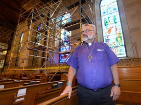 Bishop Barry Clarke shows the scaffolding erected in St. Paul's Cathedral to repair damage to the walls and roof on Thursday August 4, 2016. The church has organized a fund-raising campaign called Project Jericho to pay for the repairs MORRIS LAMONT / THE LONDON FREE PRESS / POSTMEDIA NETWORK