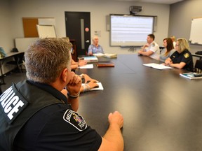 Photo courtesy of Det.-Cst. Jeremy Ashley/Belleville Police Services
Cst. Mark Hall of the Belleville Police Service participates in a meeting of the Hastings County Situation Table recently.
