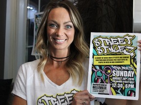 Samantha Reed/The Intelligencer
Local hair stylist Melissa Payton holds a Street Stylez poster in her home Thursday afternoon. Payton is the organizer and creator of Street Stylez, a local event where hair stylists offer free haircuts to those in need. She and her team will be holding an event later this month.