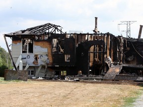 A family is staying with relatives after their home was destroyed by an overnight fire in South Frontenac, Ont. on Friday August 12, 2016. Steph Crosier/Kingston Whig-Standard/Postmedia Network
