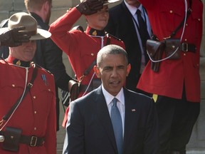 United States President Barack Obama speaks with children as he arrives on Parliament Hill in Ottawa, Wednesday June 29, 2016. THE CANADIAN PRESS/Adrian Wyld