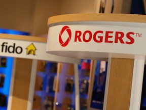Booth's for both Fido and Rogers wireless are displayed in a cellphone store in Ottawa in this undated file photo. (Chris Roussakis/Postmedia Network file photo)