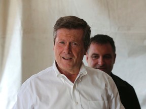 Mayor John Tory cuts some meat at Messini Authentic Gyros at the start 23rd annual Taste of the Danforth last weekend. (MICHAEL PEAKE, Toronto Sun)