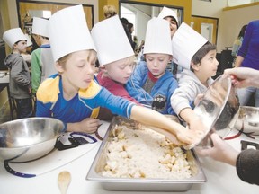 Children participate in a session with Growing Chefs Ontario in 2014. The London-based charity has a mission to to get children excited about healthy food. (London Free Press file photo)